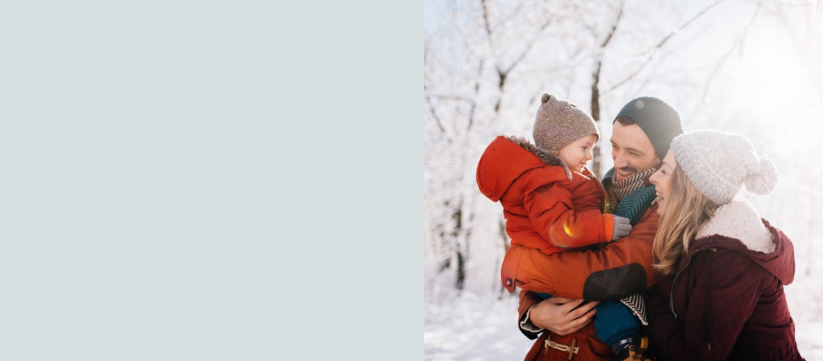 A picture of a family walking outdoors in the snow