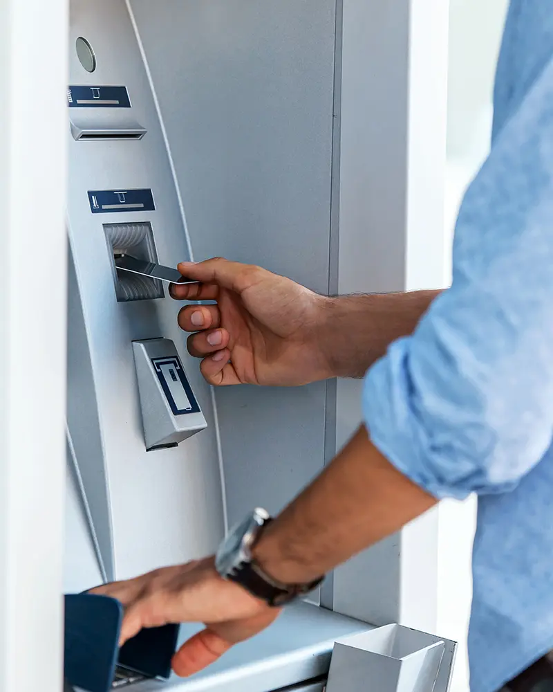 A man using an ATM machine