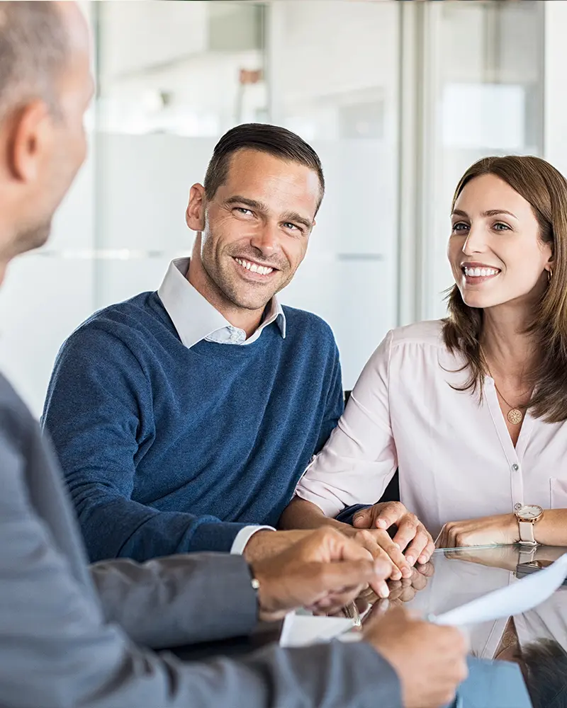 A couple in a meeting with a bank employee